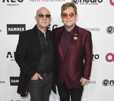 Elton John, right, and Bernie Taupin at Elton John’s 70th Birthday and 50-Year Songwriting Partnership with Taupin in Los Angeles on March 25, 2017. (Jordan Strauss / Jordan Strauss/Invision/AP)