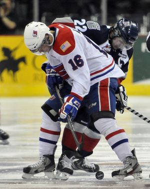 The Spokane Chiefs' Mike Aviani (16) battles the Tri-City's Justin Feser, right, for the face-off puck Friday, Mar. 22, 2013 at the Spokane Arena in the first game of the playoffs. (Jesse Tinsley / The Spokesman-Review)