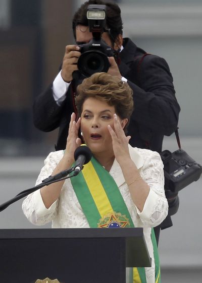 Brazil’s President Dilma Rousseff reacts Saturday while delivering a speech at the Planalto palace after  receiving the presidential sash.  (Associated Press)
