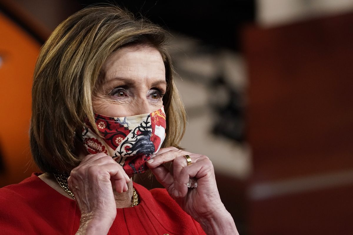House Speaker Nancy Pelosi of Calif., puts her mask back on after a news conference on Capitol Hill in Washington, Thursday, May 13, 2021.  (Susan Walsh)