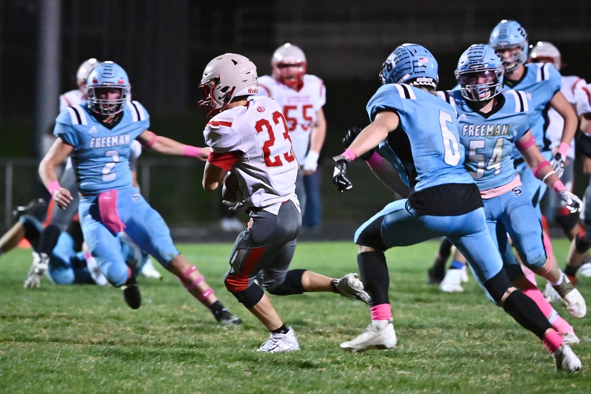 Riverside Rams Jordan Nortz (23) makes a catch in the flat against Freeman Scotties Hayden Fatherree (6) and Freeman Scotties Boen Phelps (2) during a high school football game on Friday, Oct 1, 2021 at Kent Smith field in Freeman.  (James Snook/ FOR THE SPOKESMAN-REVIEW)
