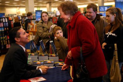
Dino Rossi speaks with Carol Quigg from Spokane at his book signing in Spokane Valley.
 (Liz Kishimoto / The Spokesman-Review)