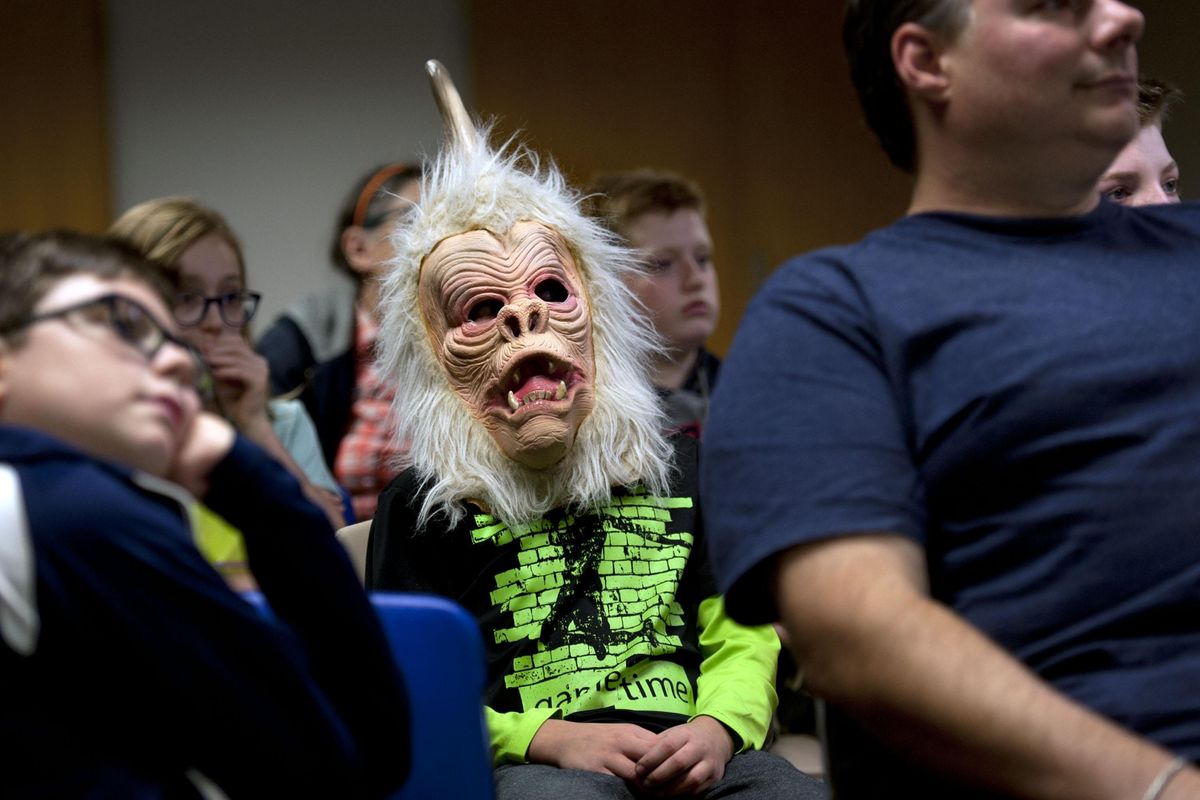 Nine-year-old Jordan Warner wears a mask from a 1967 episode if “Star Trek” during a cryptozoology presentation at Spokane Valley Library on Tuesday, Oct. 23, 2019. (Kathy Plonka / The Spokesman-Review)