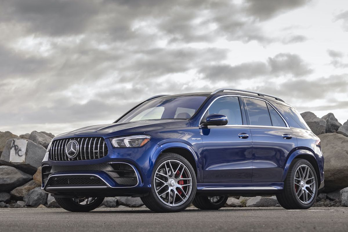 The 63 S features unique AMG design cues inside and out. Outside, there are vertical grille louvers, large black air intakes, flared wheel arches and prominent rectangular exhaust outlets. (Mercedes-Benz)