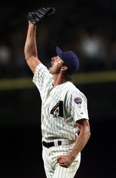 Arizona Diamondbacks pitcher Randy Johnson reacts in the ninth inning, May 8, 2001 after striking out his 20th batter against the Cincinnati Reds in Phoenix. Johnson threw 124 pitches, 92 for strikes, and walked none before being relieved by Byung-Hyun Kim to start the 10th. Johnson became only the third major league pitcher to strike out 20 in nine innings. (Emmanuel Lozano / Associated Press)