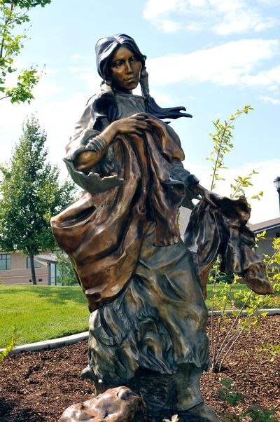 “Berry Picker” is a  larger-than-life-size bronze statue unveiled August 2011 at Centerplace in Spokane Valley. The statue is a replica of a small bronze by the late artist Nancy McLaughlin that was upsized using computer mapping technology. The bronze was placed and donated to the city of Spokane Valely by the Spokane Valley Arts Council. (Jesse Tinsley / The Spokesman-Review)