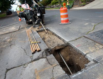 Brian Yancy of NPL drills a hole with a Ditch Witch for a new Avista natural gas line at the corner of Seminole and Alpine in Spokane in 2014.  (DAN PELLE/The Spokesman-Review)