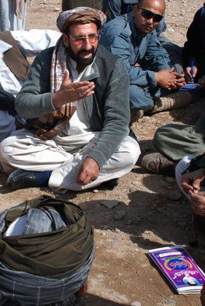 Abdul Zahir speaks to locals during a shura, or meeting, in Marjah, Afghanistan, on Feb. 22. Zahir was appointed as the new civilian chief in Marjah.  (Associated Press)