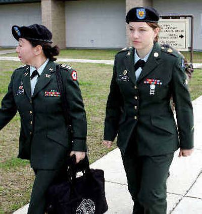 
Spc. Sabrina D. Harman, right, and her attorney Capt. Patsy Takemura leave the courthouse following a pre-trial hearing in Fort Hood, Texas, on Monday. Harmon is facing charges in connection with abuse at the Abu Ghraib prison in Iraq. 
 (Associated Press / The Spokesman-Review)