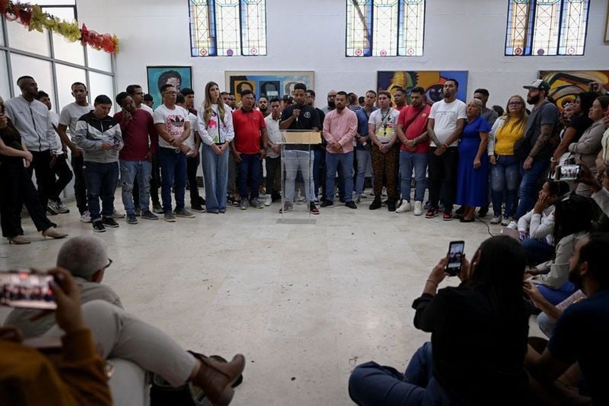 Venezuelans who where imprisoned in El Salvador’s CECOT mega-prison give statements to the press on Friday in Caracas, Venezuela. (Gaby Oraa)