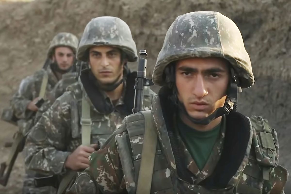 In this image taken from video released by the Armenian Defense Ministry on Wednesday, Sept. 30, 2020, Armenian solders guard their position in the self-proclaimed Republic of Nagorno-Karabakh, Azerbaijan. Armenia