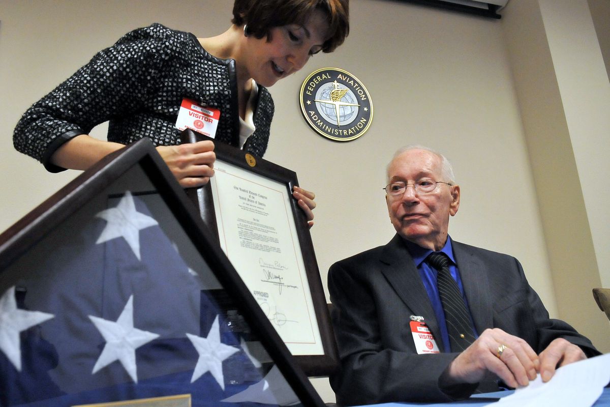 Rep. Cathy McMorris Rodgers, left, presents Ray Daves with a copy of the Act of Congress it took to get the Spokane airport tower named after him Friday at the Spokane International Airport. (Jesse Tinsley)