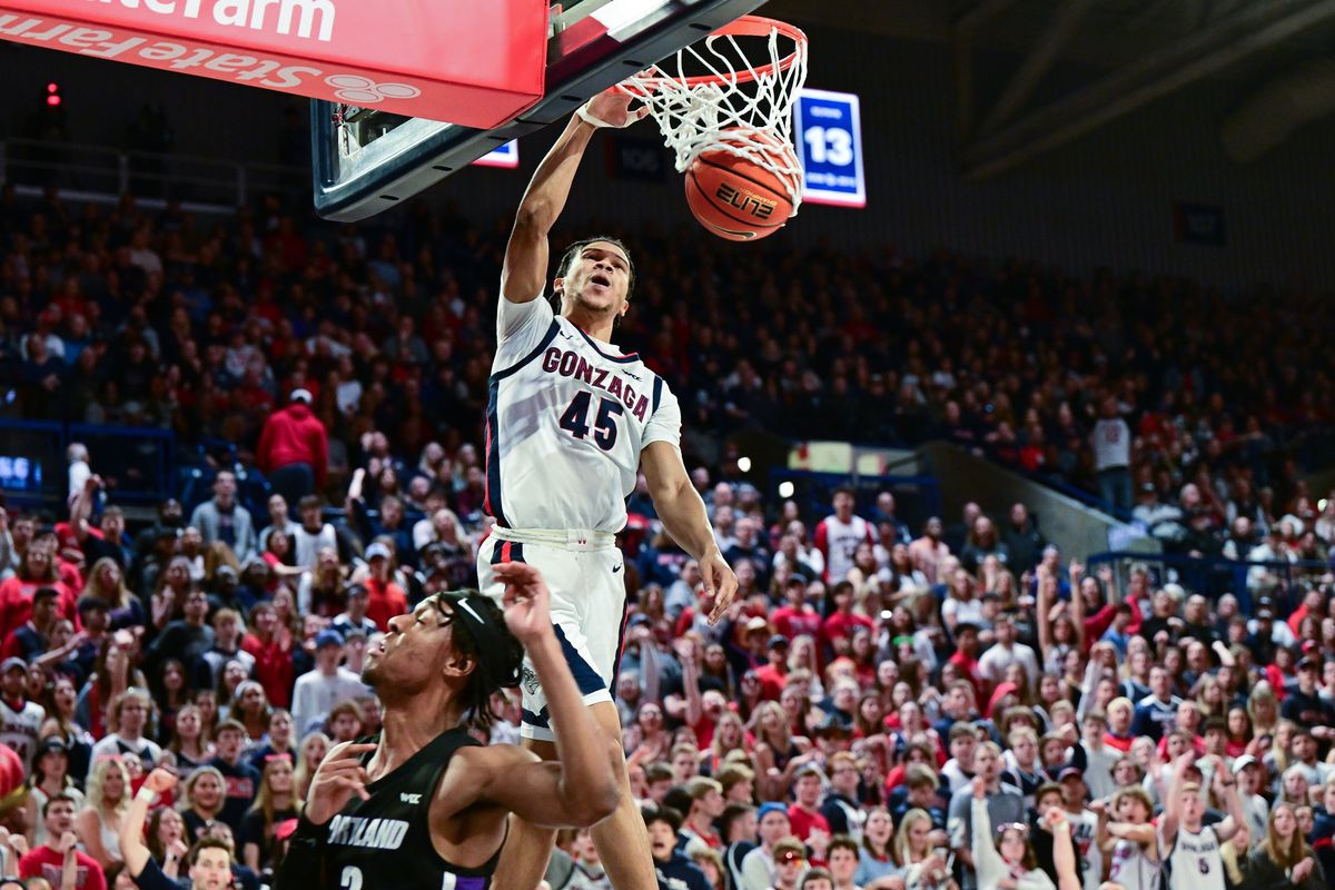 Gonzaga’s Rasir Bolton dunks against Portland forward Alden Applewhite during the first half Saturday at McCarthey Athletic Center.  (Tyler Tjomsland/The Spokesman-Review)
