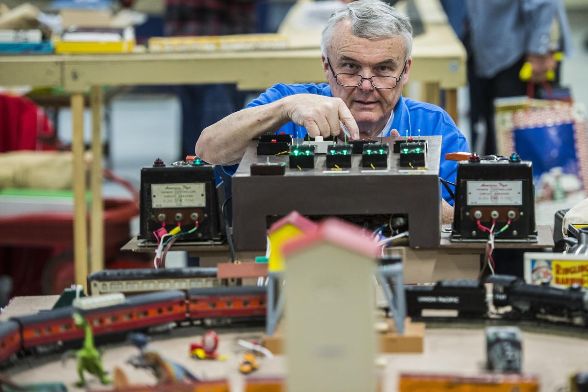 Roger Paul runs the controls to his S-scale  model train, Sunday, Oct. 15, 2017, at the Model Train Show at the Spokane County Fair & Expo Center. (Dan Pelle / The Spokesman-Review)