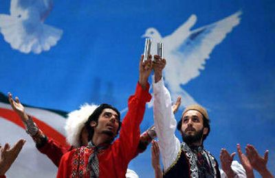 
Dancers hold capsules of uranium hexaflouride, or UF6 gas, during a ceremony Tuesday in Mashhad, Iran's holiest city. 
 (Associated Press / The Spokesman-Review)