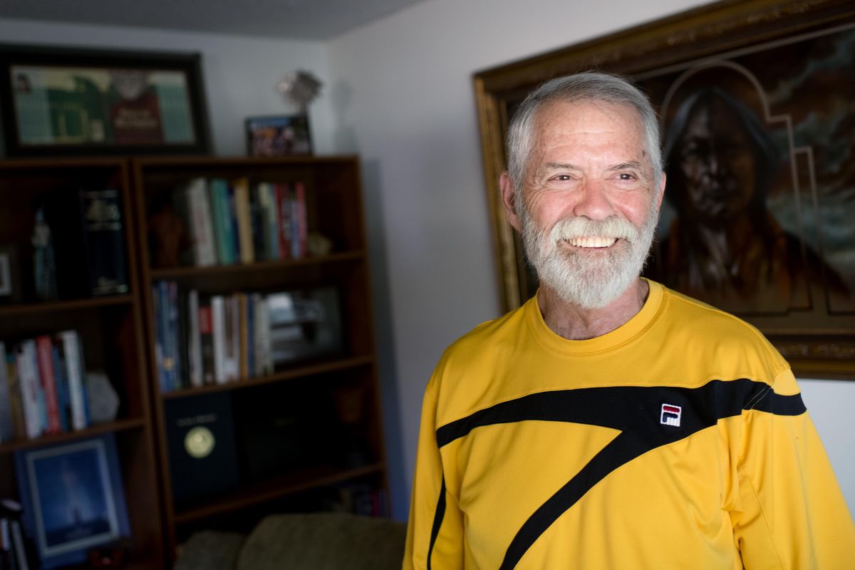 Local author Chris Crutcher poses at him home in Spokane, in the room where he wrote most of his books, on July 19, 2018. (Tyler Tjomsland / The Spokesman-Review)