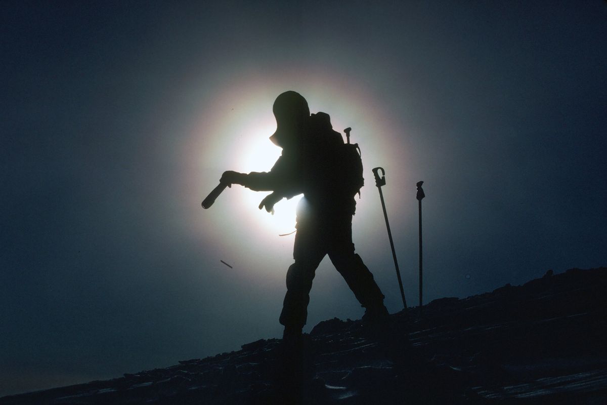 A ski patroller throws an avalanche control bomb at Alpine Meadows ski resort in California in 1982.  (Courtesy of Lanny Johnson)