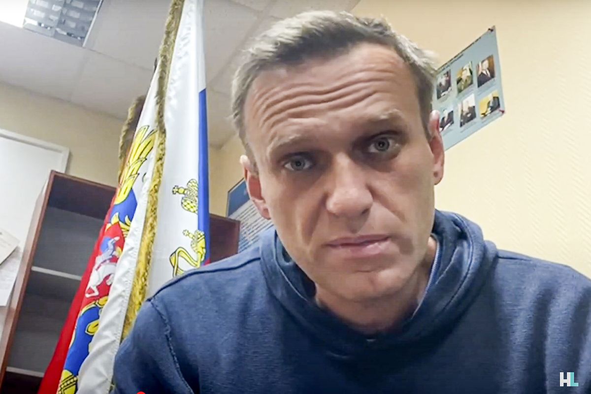 In this image taken from video released by Navalny Life youtube channel, Russian opposition leader Alexei Navalny speaks as he waits for a court hearing in a police station in Khimki, outside in Moscow, Russia, Monday, Jan. 18, 2021. A judge has ordered to remand Russian opposition leader Alexei Navalny in custody for 30 days, his spokeswoman Kira Yarmysh said on Twitter. The ruling Monday concluded an hours-long court hearing set up at a police precinct where the politician has been held since his arrest at a Moscow airport Sunday.  (HONS)