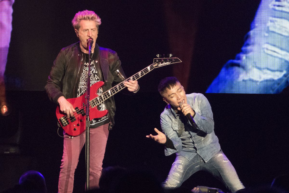 Journey lead singer Arnel Pineda, right, belts out "Only the Young" while bassist Ross Valory sings backup Thursday, Mar. 16, 2017 at the Spokane Arena. Jesse Tinsley/THE SPOKESMAN-REVIEW (Jesse Tinsley / The Spokesman-Review)