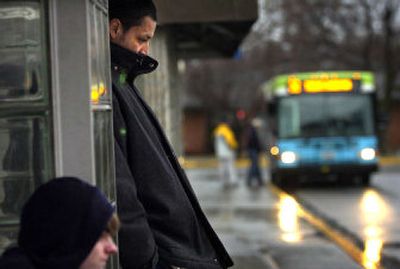 
People wait for a ride at Spokane Community College on Tuesday. STA started a discounted bus pass program for students in January. 
 (Holly Pickett / The Spokesman-Review)