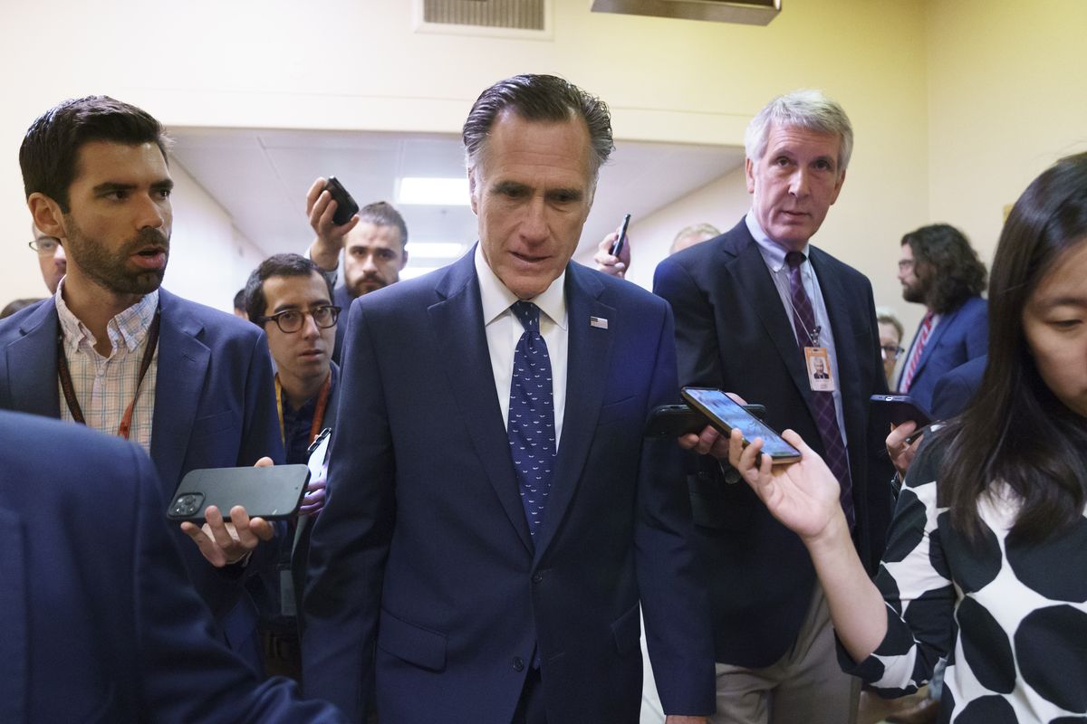 Sen. Mitt Romney, R-Utah, is surrounded by reporters as he walks to the Senate chamber for votes, at the Capitol in Washington, Thursday, June 10, 2021. Sen. Romney is working with a bipartisan group of 10 senators negotiating an infrastructure deal with President Joe Biden.  (J. Scott Applewhite)
