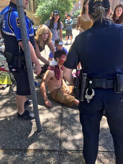 A person is treated by first responders after a deadly stabbing attack on University of Texas campus in Austin, Texas, Monday, May 1, 2017. (Emily Johnson / AP)