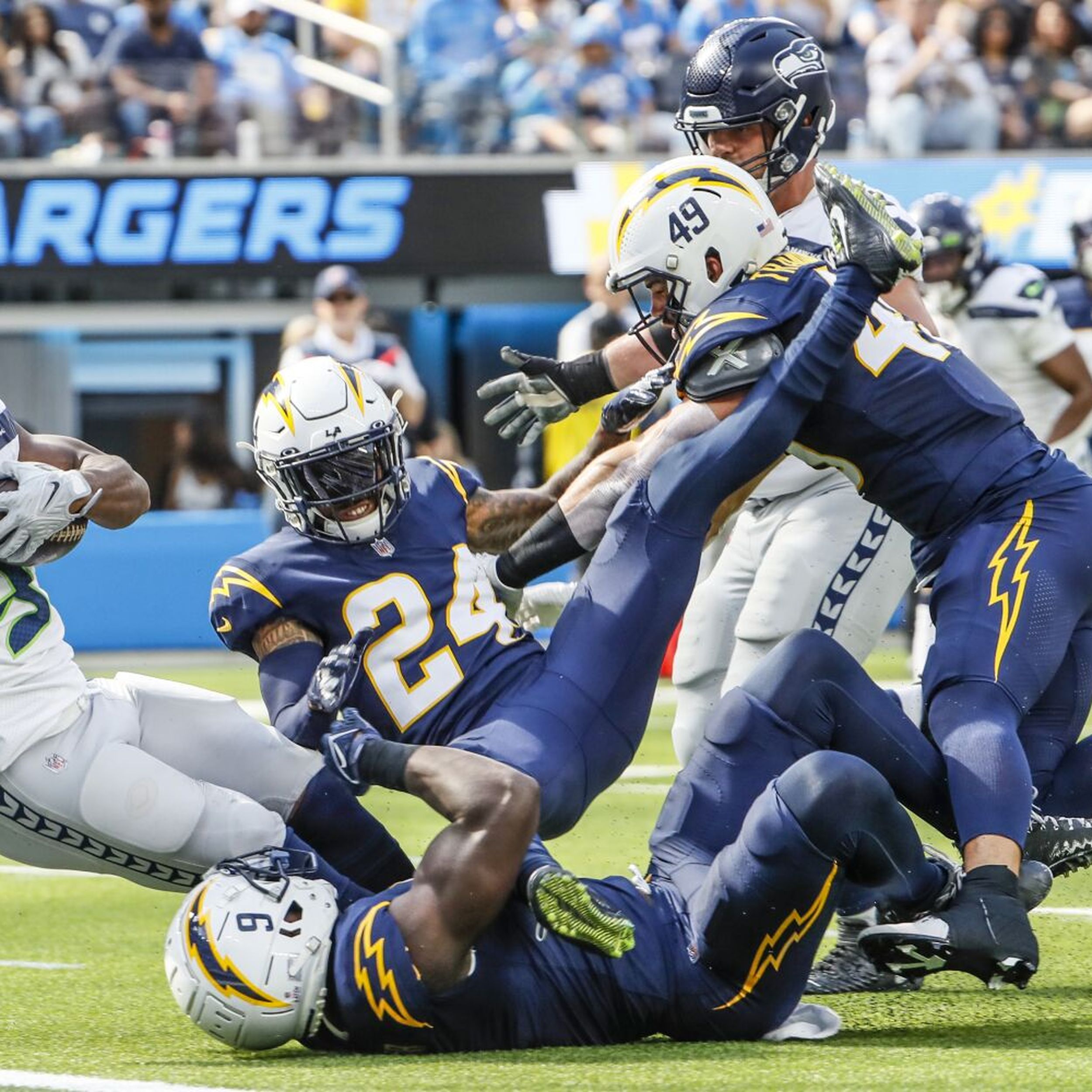 Running back Kenneth Walker III of the Seattle Seahawks is tackled