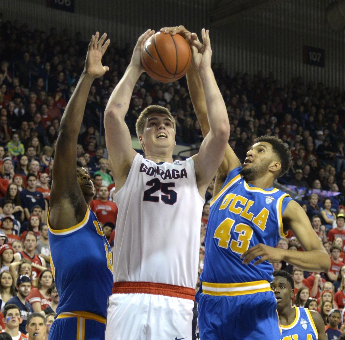 Gonzaga’s Ryan Edwards is roughed up by UCLA’s Tony Parker, left, and Jonah Bolden, right, in the first half Saturday, Dec. 12, 2015 at McCarthey Athletic Center. UCLA edged the Zags 71-66. (Jesse Tinsley / The Spokesman-Review)