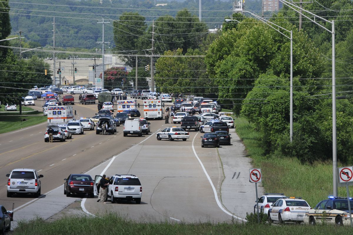 Police and emergency vehicles block Amnicola Highway after a morning shooting near the Naval Reserve Center, in Chattanooga, Tenn. on Thursday, July 16, 2015.  Chattanooga Mayor Andy Berke said there