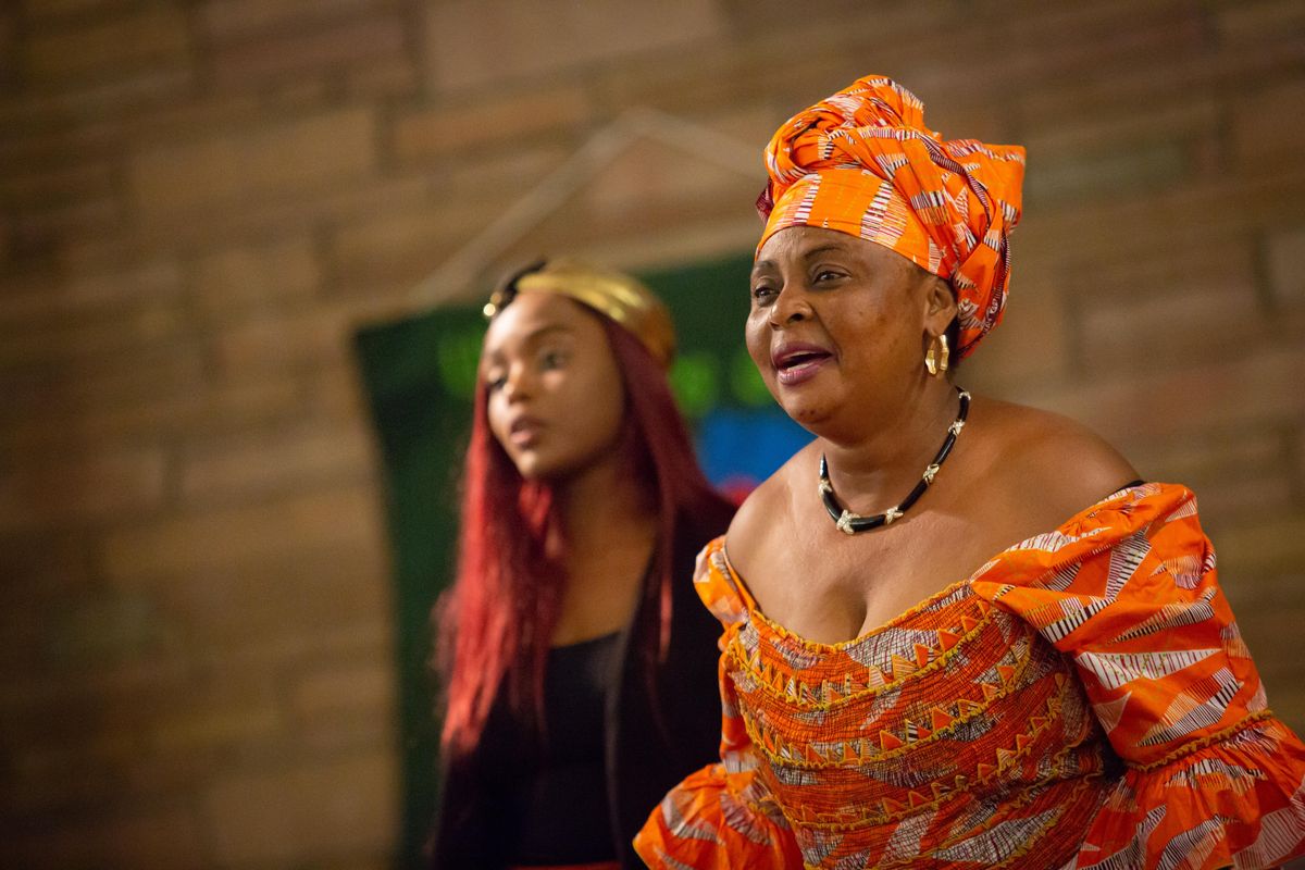 Lay pastor Marie Mwange leads an evening Swahili service while  Marcelline Mwange, left, is on hand to translate at Fowler United Methodist Church, 3928 N. Howard St., in Spokane on Sunday, Aug. 25, 2019. Pastor Marie Mwange studied ministry and became a Methodist lay pastor while in a refugee camp in Uganda. (Libby Kamrowski / The Spokesman-Review)