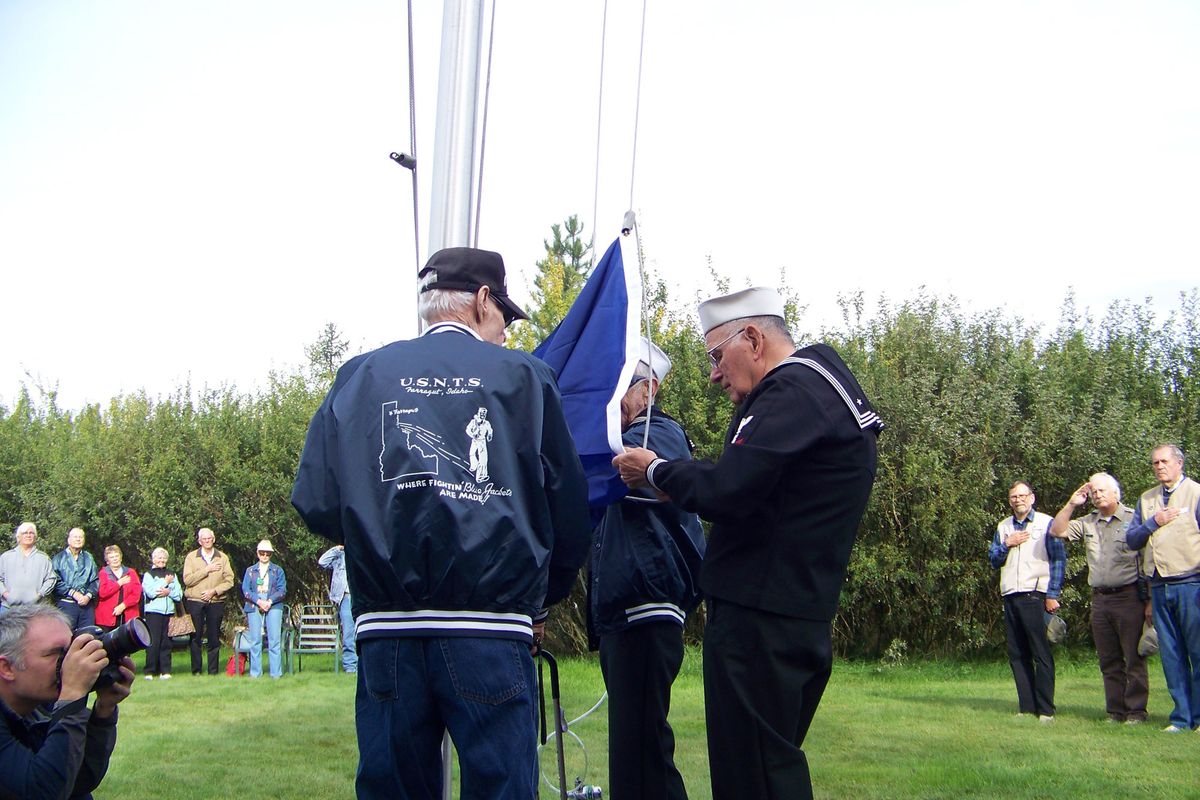 Charles Lish, Al Sweetman and Gene Cooper raised the flag Sept. 11 during events at Farragut.