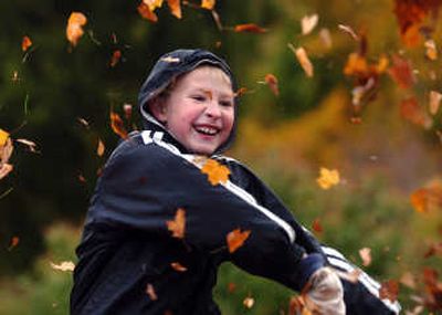 James Marshall, 9, of Spokane, throws leaves at the Fall Leaf Festival at John A. Finch Arboretum on Saturday. The event was sponsored by the Spokane Parks and Recreation Department.
(INGRID BARRENTINE / The Spokesman-Review)