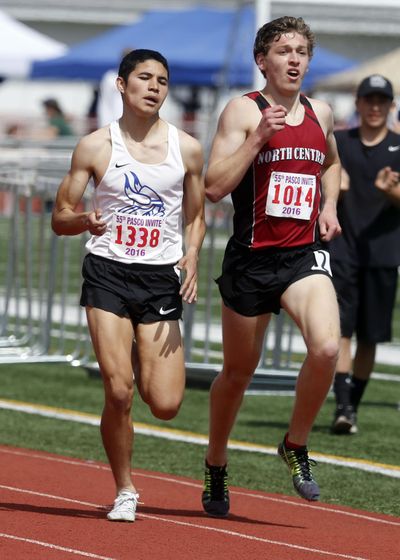 North Central High School’s Justin Janke, in a battle with Umatilla’s Fabian Cardenas in the mile at the Pasco Invite on April 16, recently broke the school record in the 1,600 meters. (Sarah Gordon / Tri-City Herald)