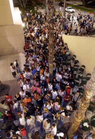 
Several hundred voters wait in line to cast their ballot two hours after the polls were supposed to close on Election Day on the campus of the University of Miami. Several hundred voters wait in line to cast their ballot two hours after the polls were supposed to close on Election Day on the campus of the University of Miami. 
 (Associated PressAssociated Press / The Spokesman-Review)
