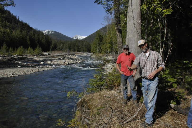 Forest Service hydrologist Kevin Davis, right, along Lightning Creek, which was still flowing low and clear on a 70-degree April 30, 2014, near Hope, Idaho. (Rich Landers)