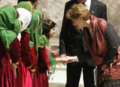 
U.S. first lady Laura Bush is greeted by Afghan schoolchildren upon her arrival Wednesday at Kabul University in Kabul, Afghanistan.
 (Associated Press / The Spokesman-Review)