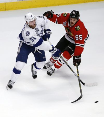 Lightning's Steven Stamkos, left, defended by Andrew Shaw, is looking for his first goal in this Final. (Associated Press)