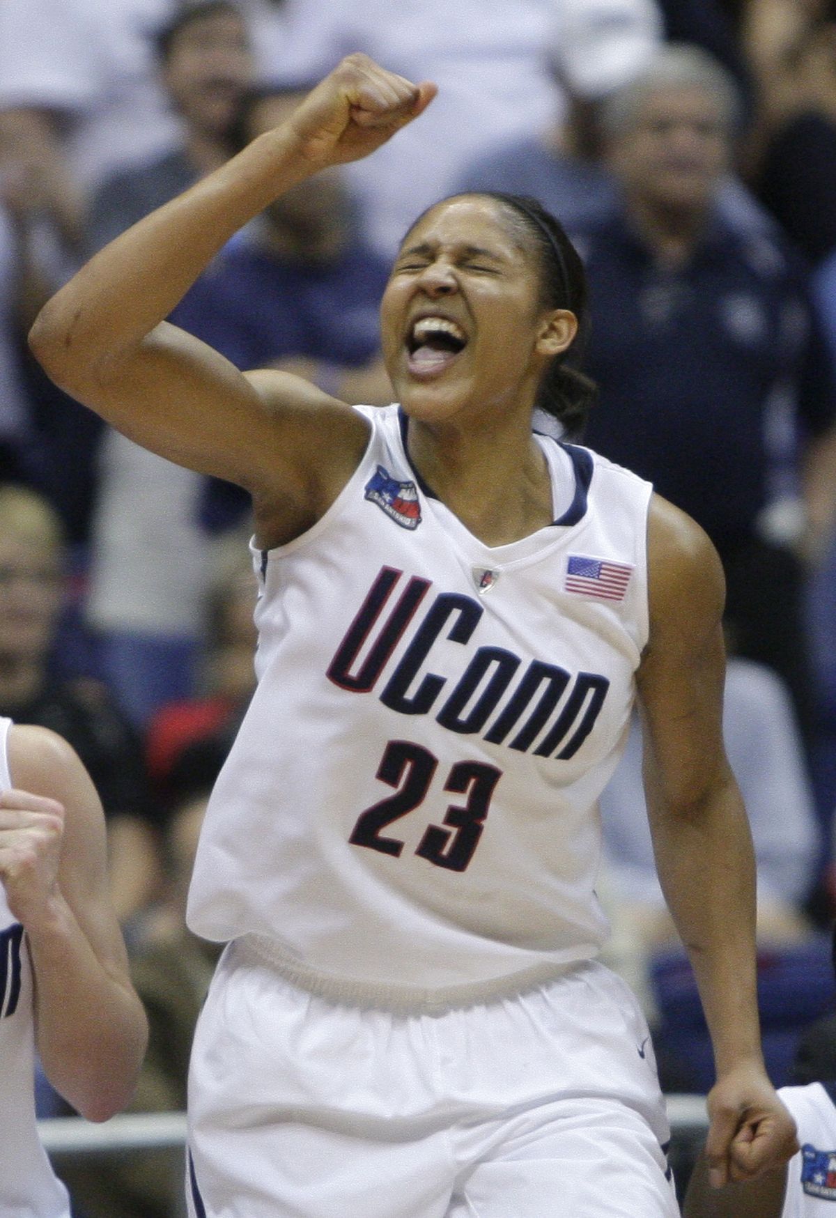 Connecticut’s Maya Moore celebrates after scoring 34 points and pulling down 12 rebounds in the Huskies’ 77th consecutive victory. (Associated Press)