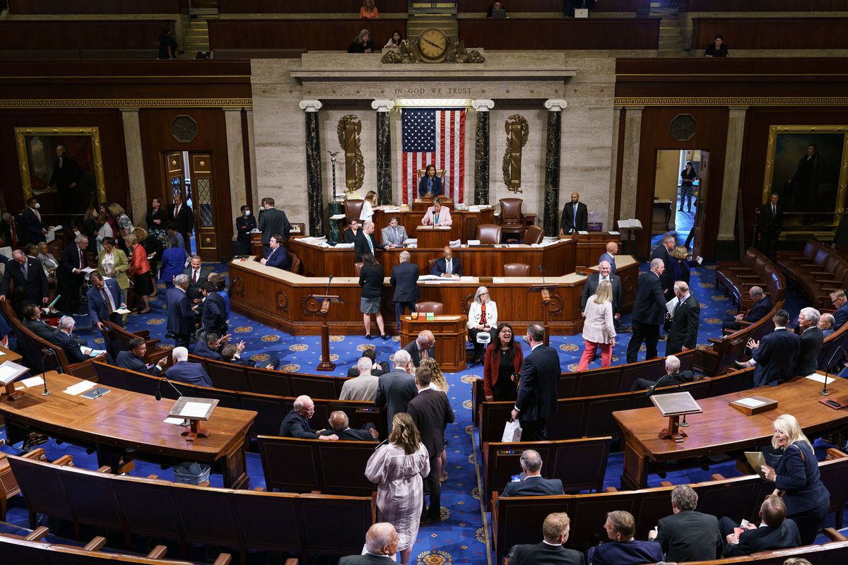 FILE - Members of the House of Representatives gather in the chamber to vote on creation of a select committee to investigate the Jan. 6 Capitol insurrection, at the Capitol in Washington, on June 30, 2021.  (J. Scott Applewhite)