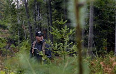 Coeur d'Alene Tribe wildlife biologist Tom Prewitt prepares to install a boundary fence last week along tribal land near Benewah Valley Creek, south of Plummer. Prewitt received his degree from the University of Idaho in May, the first graduate of the Operation Education program.
(Kathy Plonka / The Spokesman-Review)