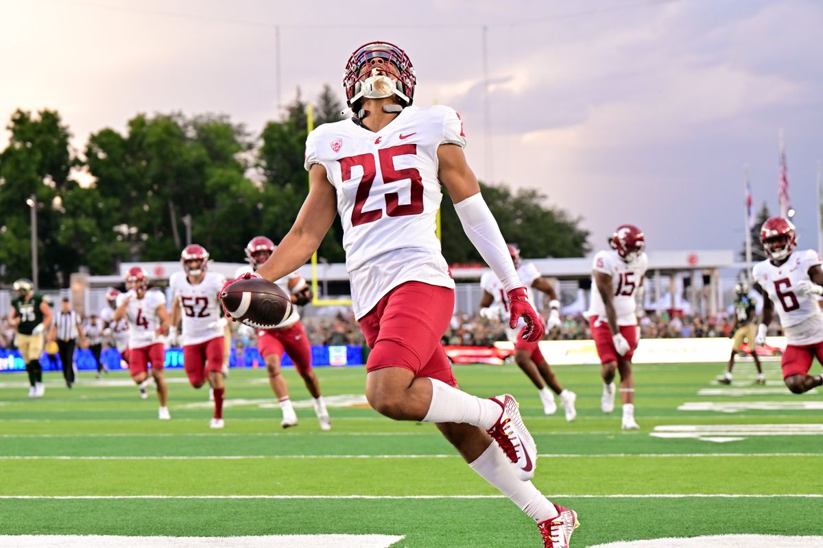 Washington State Cougars defensive back Jaden Hicks (25) smiles as he runs into the end zone for a pick-six during the second half of a college football game on Saturday, Sept. 2, 2023, at Canvas Stadium in Fort Collins, Colo. WSU won the game 50–24.  (Tyler Tjomsland/The Spokesman-Review)