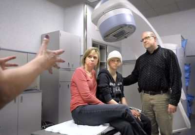 Tami, Hannah and Mike Baumann listen to registered nurse Marcy Kelly in the radiology department at Sacred Heart  Medical Center on Friday. An aspiring dancer, Hannah put off her cancer treatment until after she could perform with the Moscow Ballet.  (CHRISTOPHER ANDERSON / The Spokesman-Review)