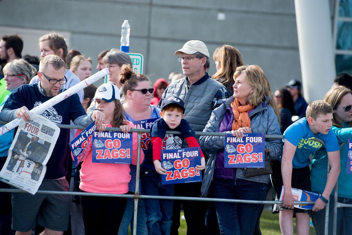 Ezekiel Morgan, 6, center waits with his family members for the Zags' bus to appear during a homecoming welcome for the Gonzaga basketball team on Tuesday, April 4, 2017, at McCarthey Athletic Center in Spokane, Wash. (Tyler Tjomsland / The Spokesman-Review)