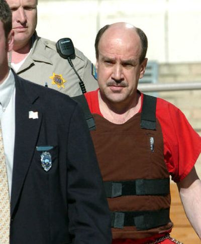 
Daniel Deisz is led from court after being sentenced to 15 years in prison. 
 (Jesse Tinsley / The Spokesman-Review)