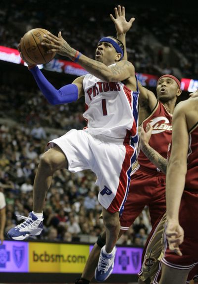 Pistons’ Allen Iverson goes to the basket past Cavaliers’ Mo Williams. (Associated Press / The Spokesman-Review)