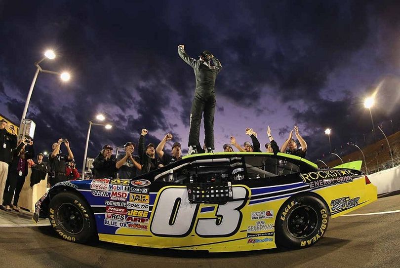 Dylan Kwasniewski stands atop his No. 03 Royal Purple/Rockstar Ford. (Photo Credit: Getty Images for NASCAR) (Christian Petersen / Getty Images North America)