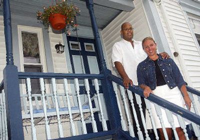 
Beth Gissinger and Luis Rivera stand on the back porch of their house in Fairhaven, Mass. Smaller cities and towns are luring away urban professionals seeking a better life.
 (Associated Press / The Spokesman-Review)