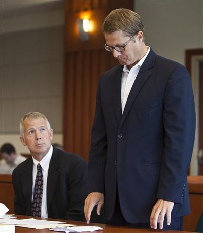 Former Idaho State Senator John McGee, right, appears in court at the Ada County Courthouse in Boise with attorney Scott McKay, Tuesday, Aug. 21, 2012. (AP/Idaho Statesman / Darin Oswald)