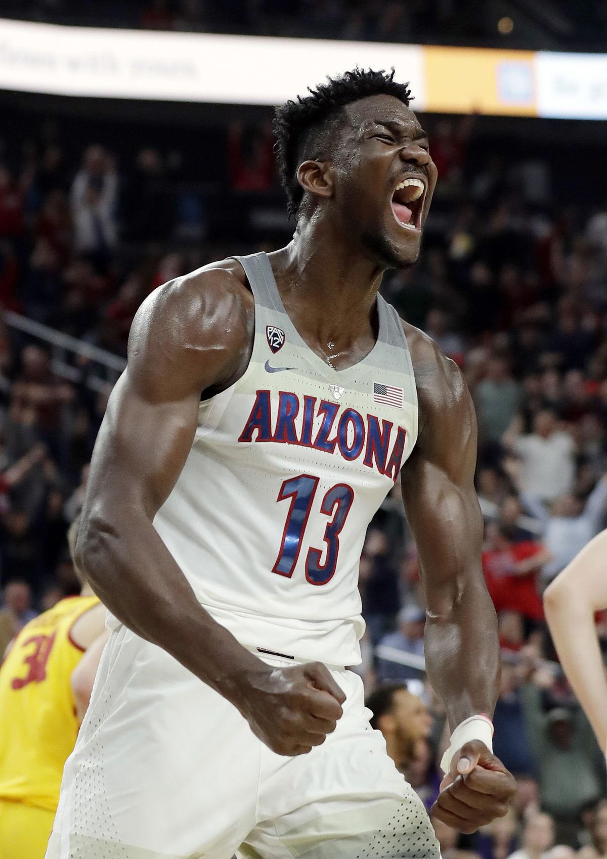 In this March 10, 2018, file photo, Arizona’s Deandre Ayton reacts after a dunk against Southern California during the second half of an NCAA college basketball game for the Pac-12 men’s tournament championship, in Las Vegas. Ayton was a force in his lone college season and looks like the favorite to land with Phoenix as the No. 1 overall pick in Thursday’s NBA Draft. (Isaac Brekken / Associated Press)