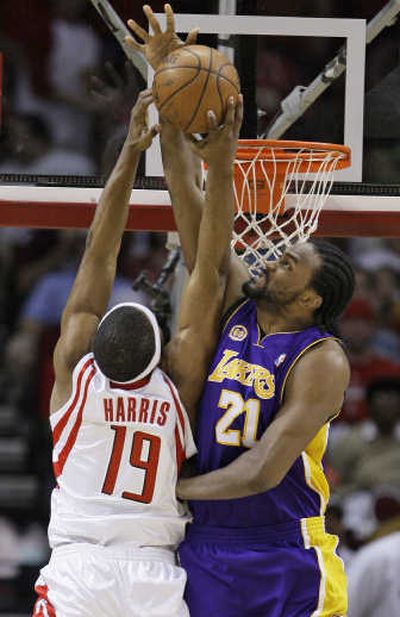 
Los Angeles Lakers' Ronny Turiaf, right, blocks the shot of Houston Rockets' Mike Harris. Associated Press
 (Associated Press / The Spokesman-Review)